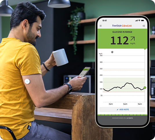 A man wearing a FreeStyle Libre sensor looking at his app next to an inset image of the smartphone app screen.