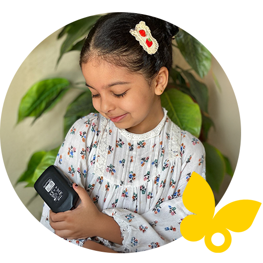 Young girl using FreeStyle Libre Reader