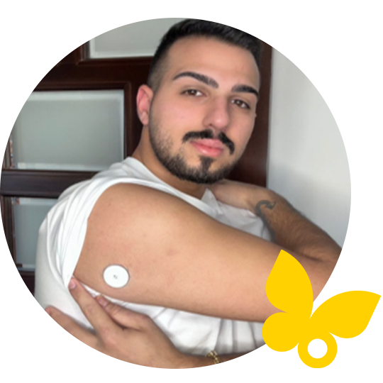 Man showing FreeStyle Libre sensor on his arm