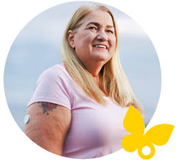 A woman outdoors wearing freestyle libre 2 sensor