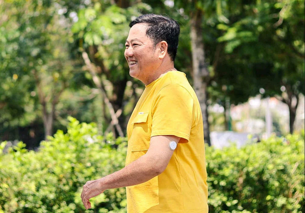 Active man outdoors wearing FreeStyle Libre sensor