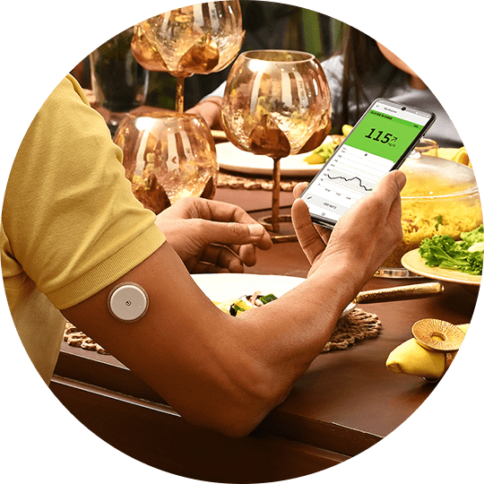 man wearing Freestyle Libre sensor while eating food to manage diabetes