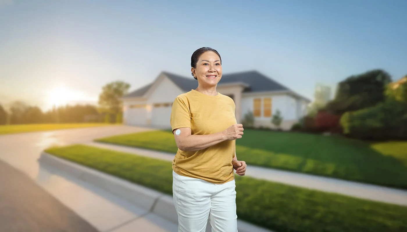 A woman jogging with a FreeStyle sensor
