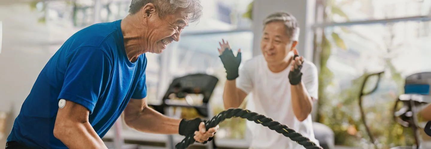 Two senior gentlemen in a gym