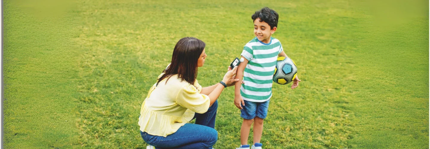 Mother scanning glucose for son