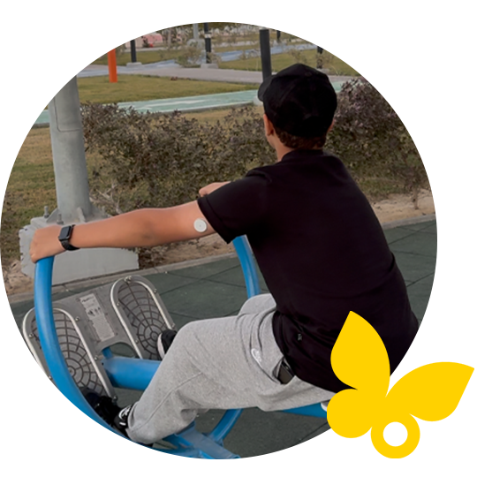 Boy at playground wearing FreeStyle Libre sensor