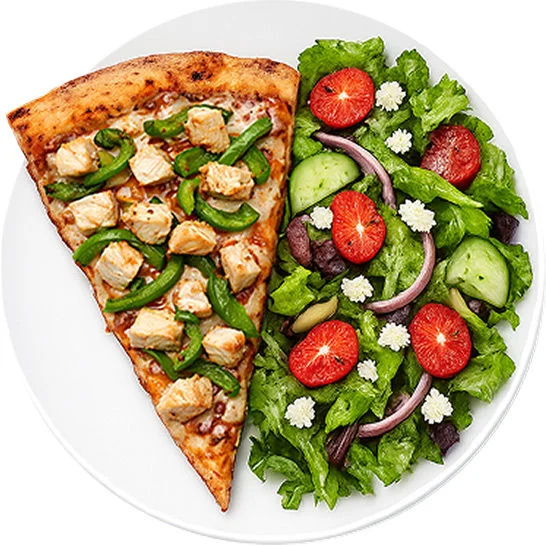 Slice of chicken and green pepper pizza served with a fresh salad on a white plate.