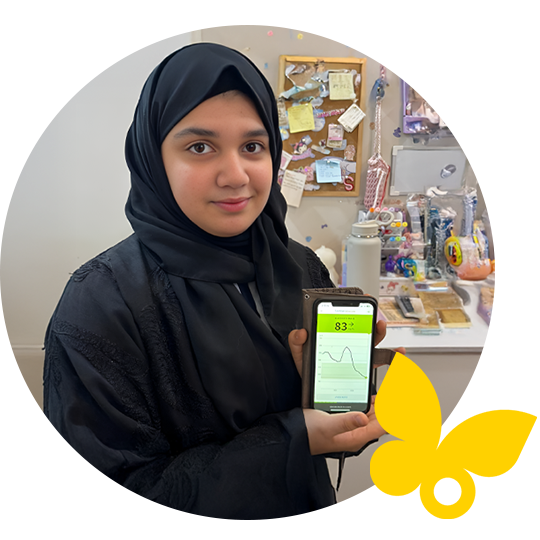 Woman holding mobile phone with Libre app