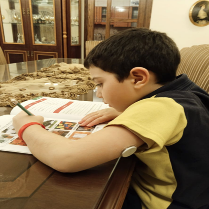 Boy wearing sensor while studying