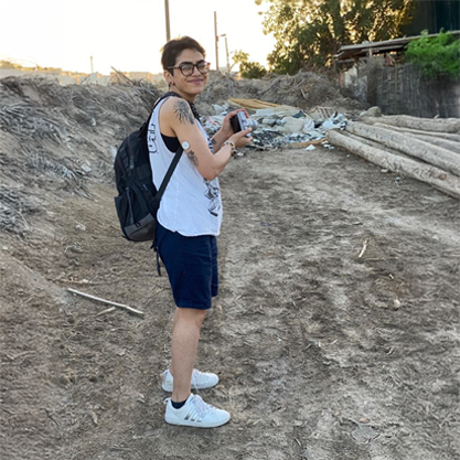 A woman wearing a sensor while hiking