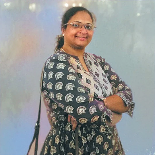 Punitha smiling while she crossed arms