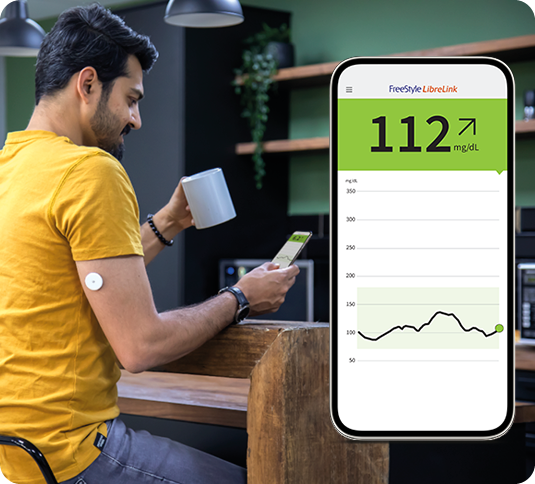 A man wearing a FreeStyle Libre sensor looking at his app next to an inset image of the smartphone app screen.