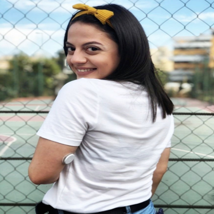 Woman wearing sensor looking over her shoulder