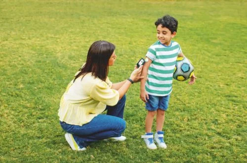 Mother scanning glucose for son