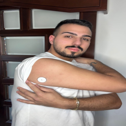 Man showing sensor on his arm