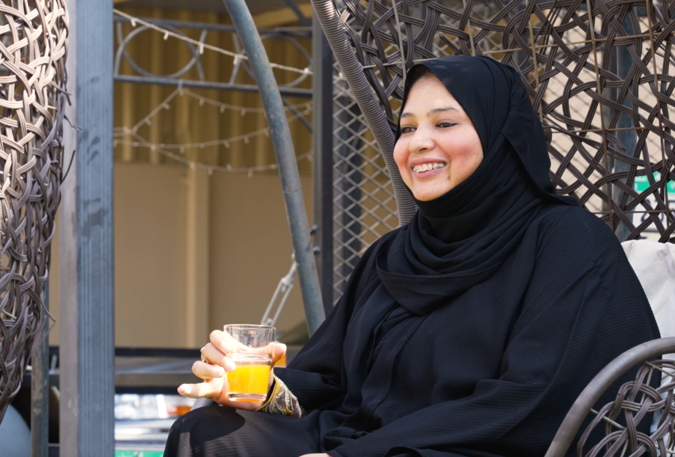 A man with tatoos wearing a sensor while eating.