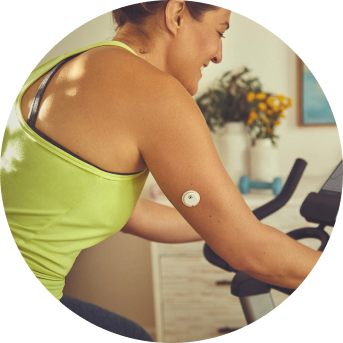 Woman exercising while wearing a FreeStyle Libre 3 Plus sensor