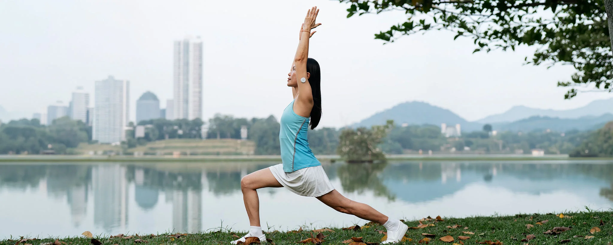 A woman doing yoga in the park