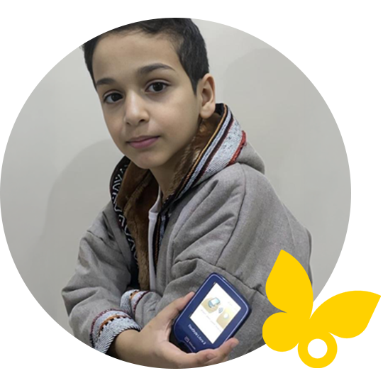 Boy taking a glucose reading with his mobile phone