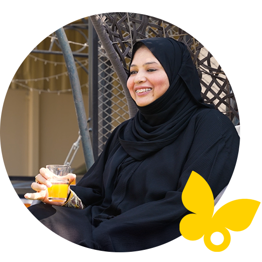 Vance smiling while showing her FSL system