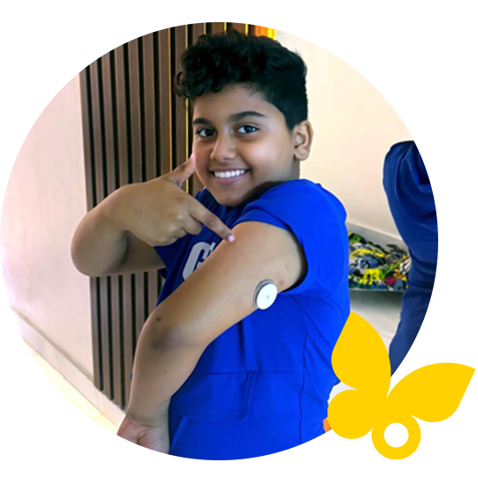 Boy pointing to his FreeStyle Libre sensor