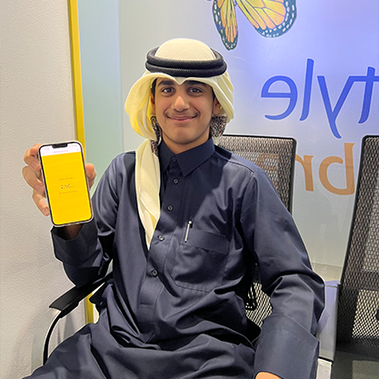 A young man holding a mobile phone