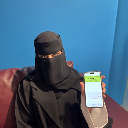 A woman showing her mobile phone