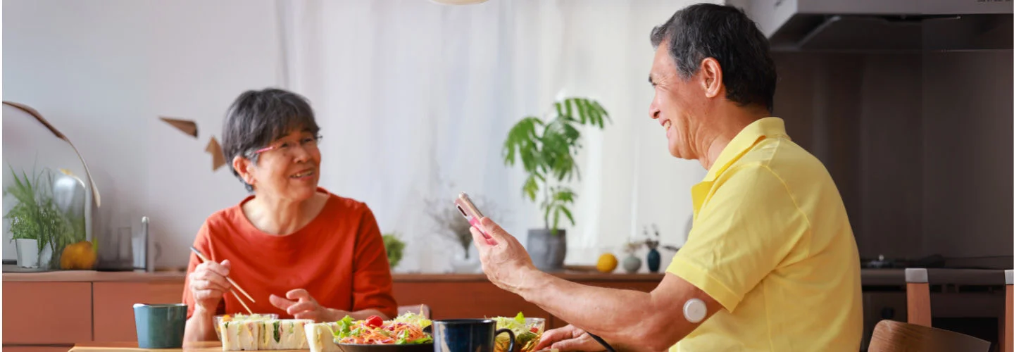 Grand parents in kitchen cooking