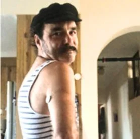 Man wearing FreeStyle Libre sensor looking over his right shoulder