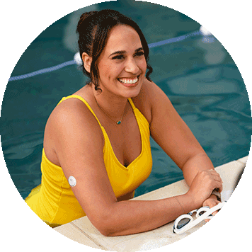 Woman by the pool wearing a FreeStyle Libre 3 Plus sensor