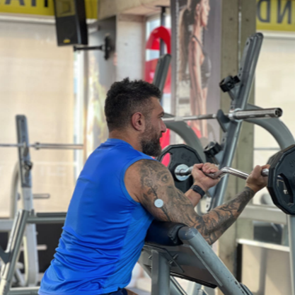 Man wearing a sensor while weight lifting