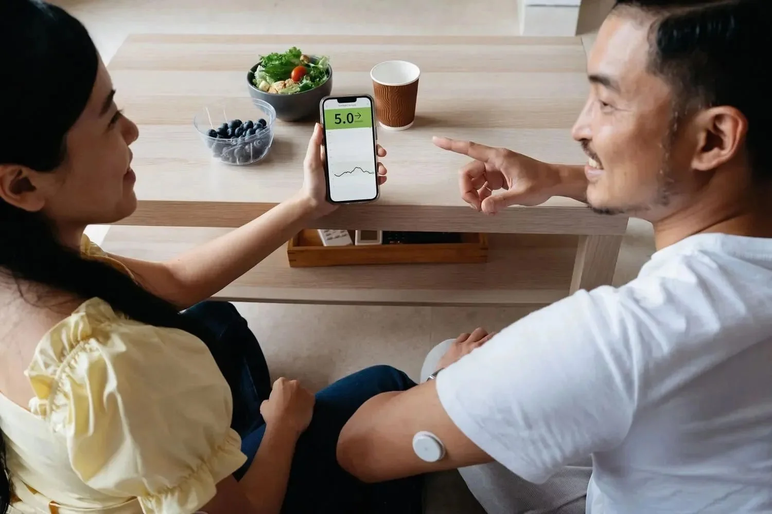 Friends showing each other FreeStyle Libre app