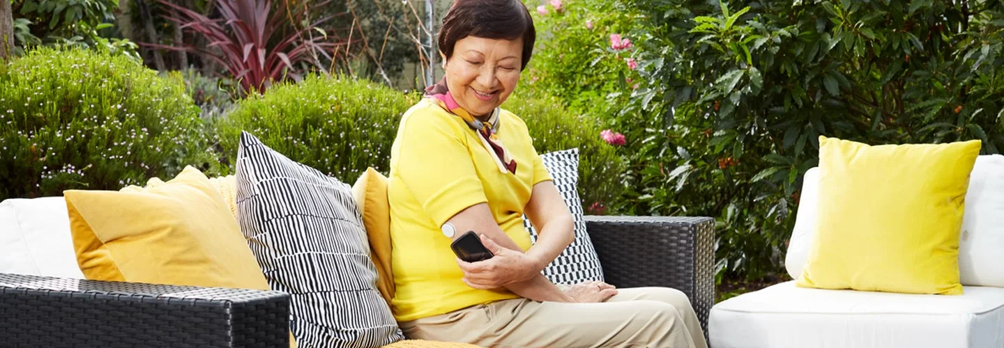 Man scanning his FreeStyle Libre sensor on his arm