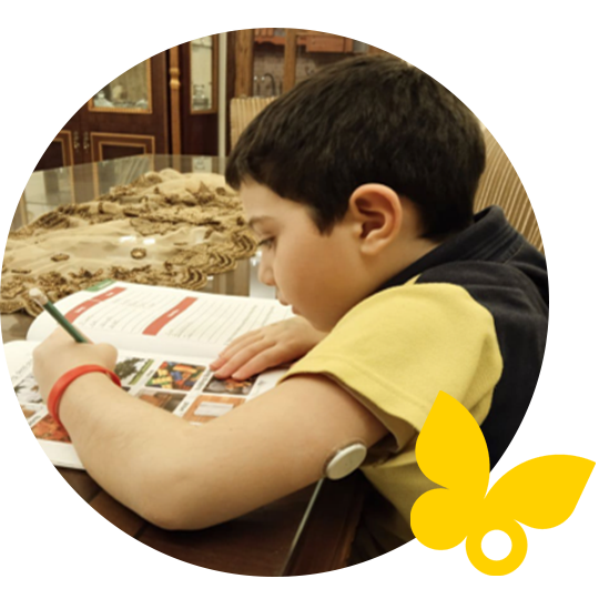 Boy studying while wearing sensor