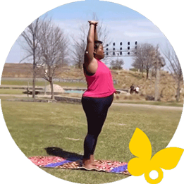 Woman stretching in the park wearing a FreeStyle Libre 3 Plus sensor