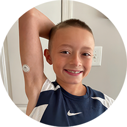 Illustration of a child showing a CGM sensor on the upper arm while wearing a sleeveless athletic shirt.