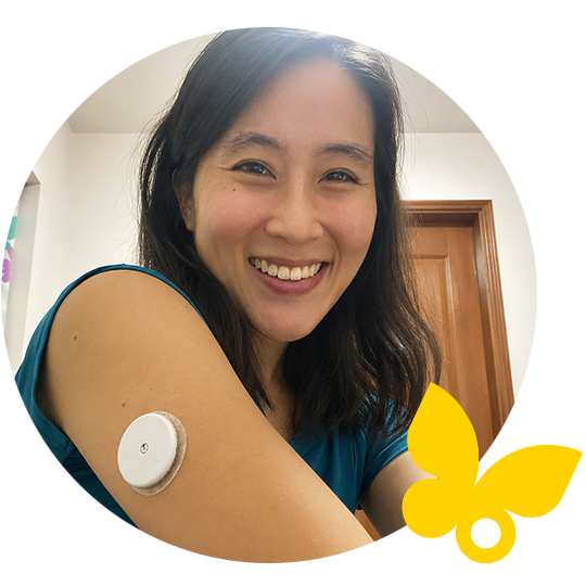 A woman smiling wearing sensor