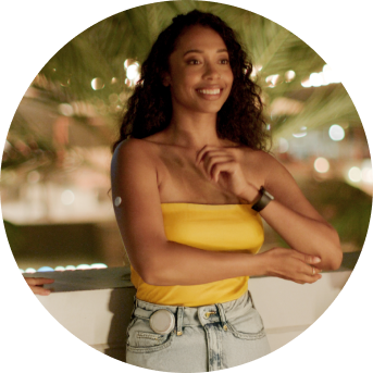 Smiling woman wearing a twiist™ AID System