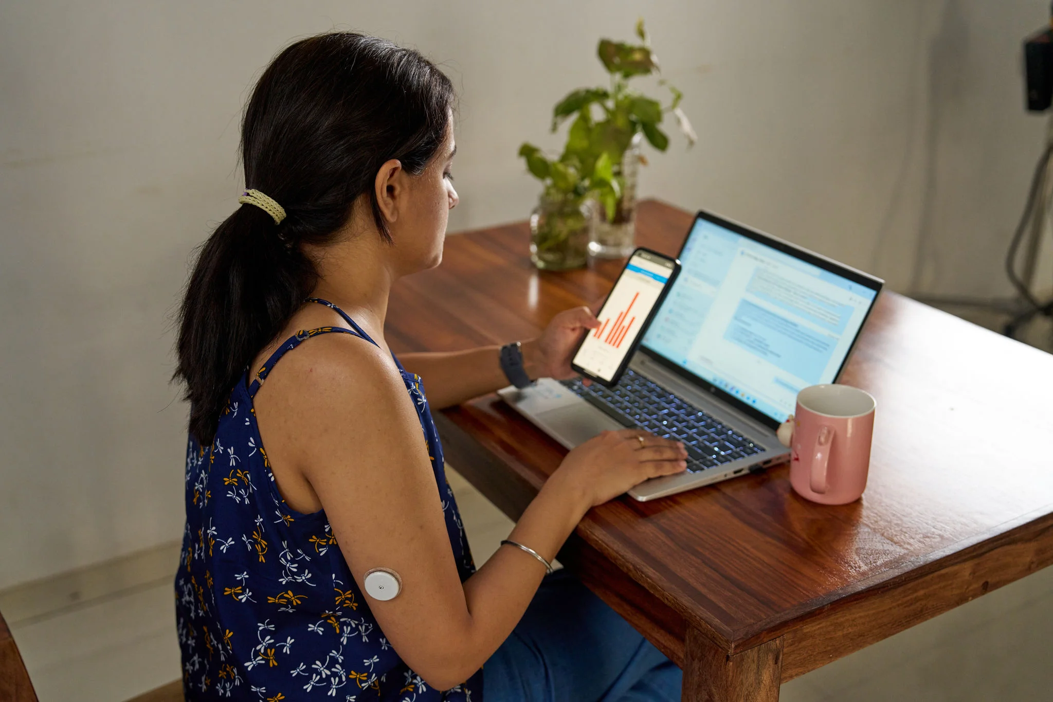 A man sitting at a table on a laptop