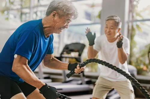 Elderly man exercising on treadmill