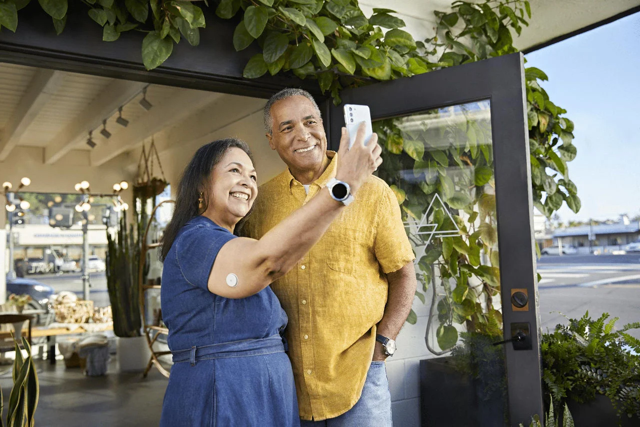 2 people smiling taking a selfie