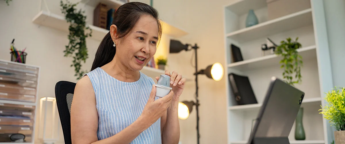 Woman with a sensor and telemedicine.