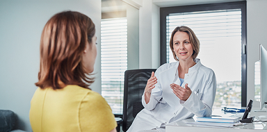 Woman talking to a doctor