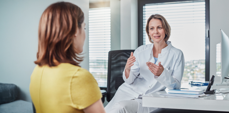 Woman talking to a doctor