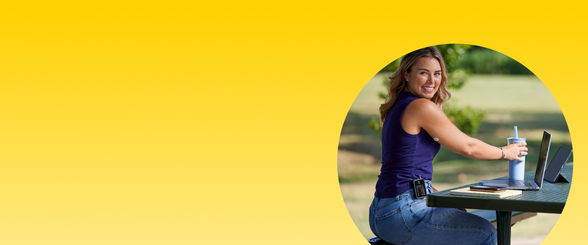 Smiling man wearing a FreeStyle Libre 2 Plus sensor and Omnipod® 5 insulin pump checks his blood glucose