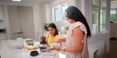 Woman wearing a FreeStyle Libre 3 Plus sensor