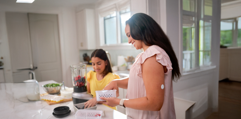 Woman wearing a FreeStyle Libre 3 Plus sensor