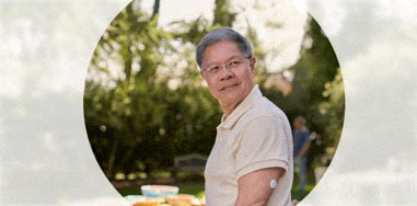 Man standing outdoors wearing a FreeStyle Libre 2 sensor