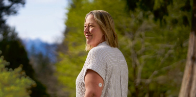 Woman outdoors wearing a FreeStyle Libre 3 Plus sensor