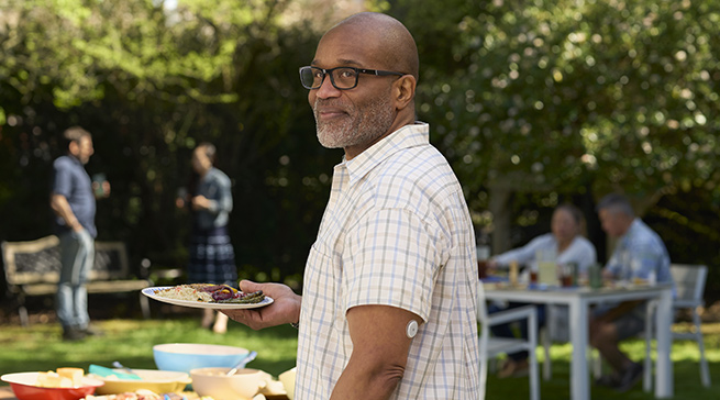 Man wearing a FreeStyle Libre 2 sensor